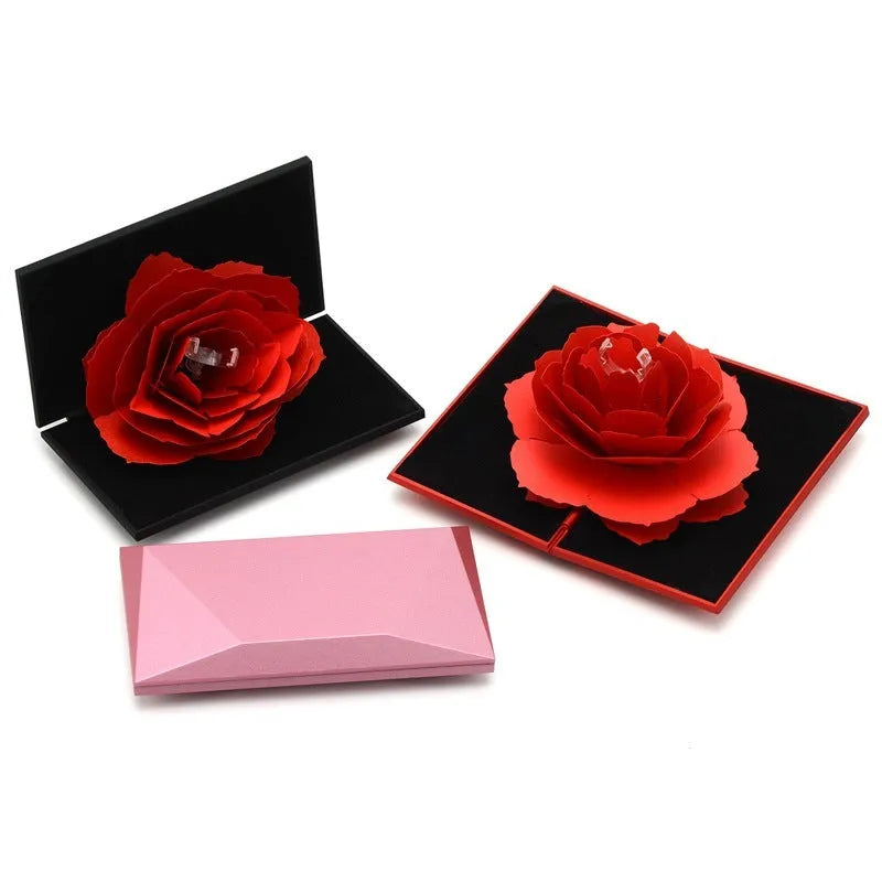 Red heart-shaped rotating ring box with 3D love design and rose flower pattern for jewellery storage