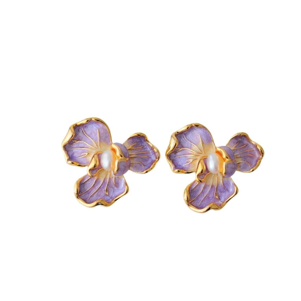 Purple copper alloy flower-shaped women's earrings with dripping oil finish on a plain background