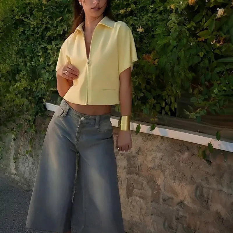 Model wearing a loose-fit short sleeve casual top in yellow damascus style.