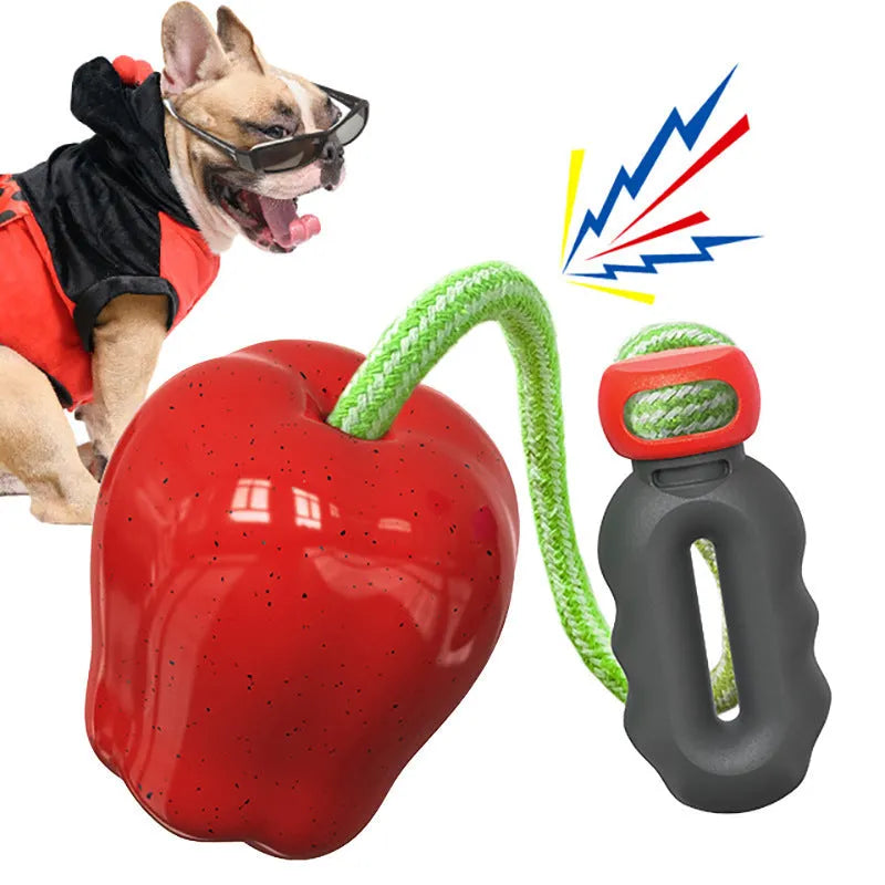 Green apple-shaped dog chew toy with textured surface and food-dispensing hole