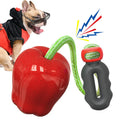 Green apple-shaped dog chew toy with textured surface and food-dispensing hole