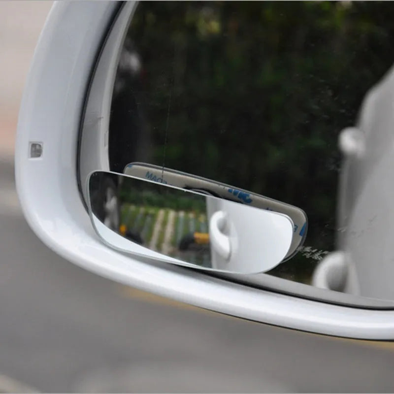 Glass adjustable blind spot mirror with angle adjustment bracket for car rearview mounting.