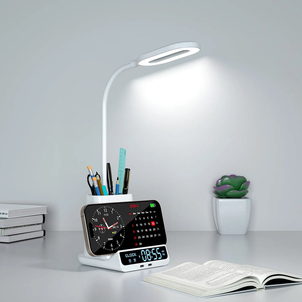Modern desk lamp with wireless charging pad, storage box, and pen holder on a wooden desk.