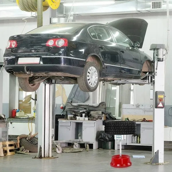 Portable wheel balancer tool with aluminium head and bull's-eye level on a black enamel base.