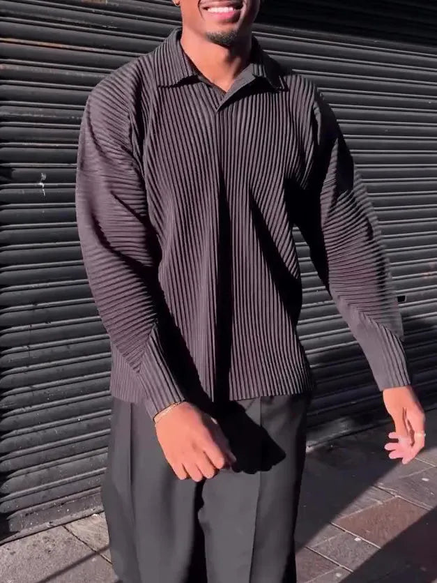 Black men's long-sleeved casual shirt with a pleated design detail on the front.