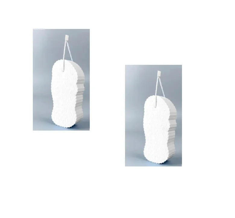 White 3D fish scale pattern bath sponge with hang loop on a bathroom background.