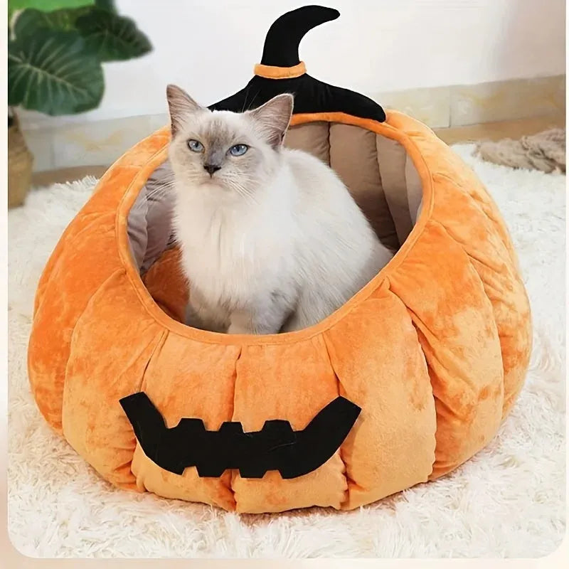 Halloween-themed orange pumpkin-shaped soft plush bed for a cat or small dog, featuring a cartoon devil design.