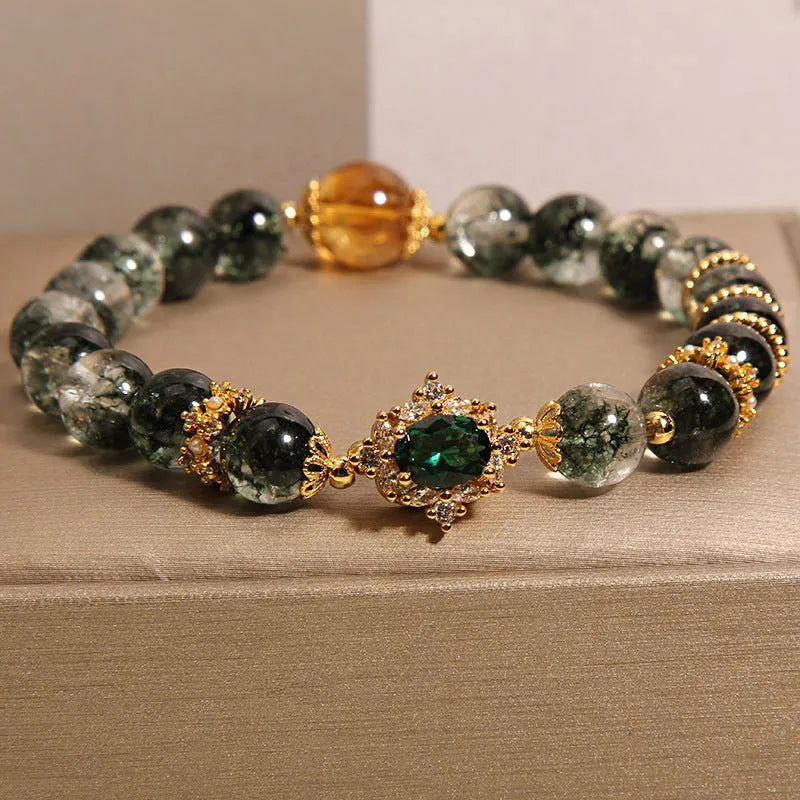 Gold rutilated quartz crystal bracelet with green phantom quartz and visible rutile inclusions