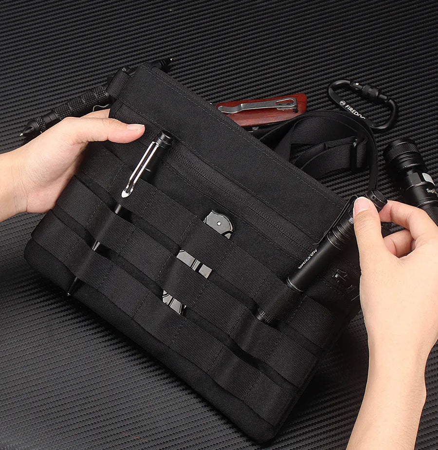 Black Oxford cloth portable outdoor kit measuring 18 by 3.5 centimetres