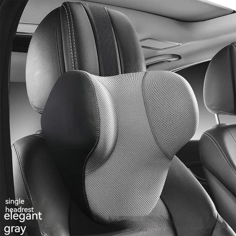 Black memory foam car headrest and lumbar support pillow set on a car seat
