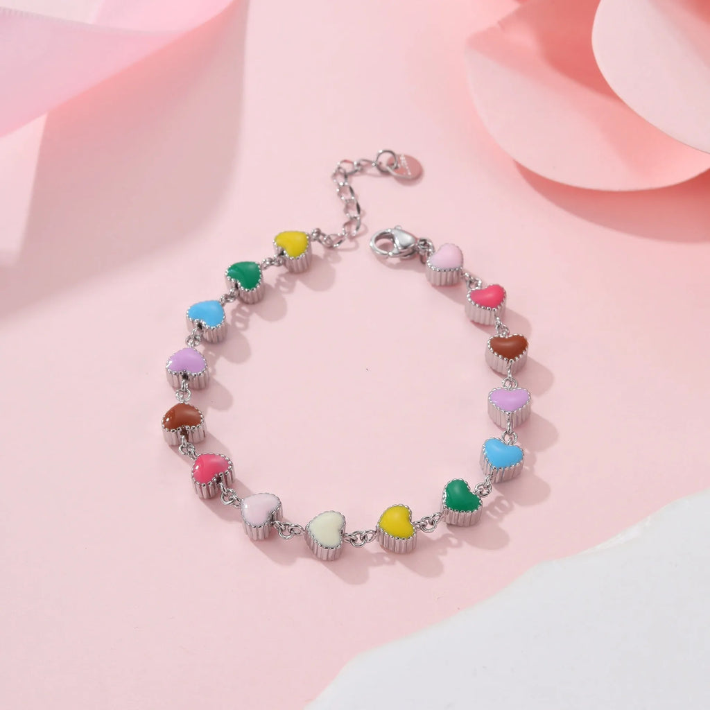 Women's gold bracelet with love heart design, stainless steel construction, and electroplated finish