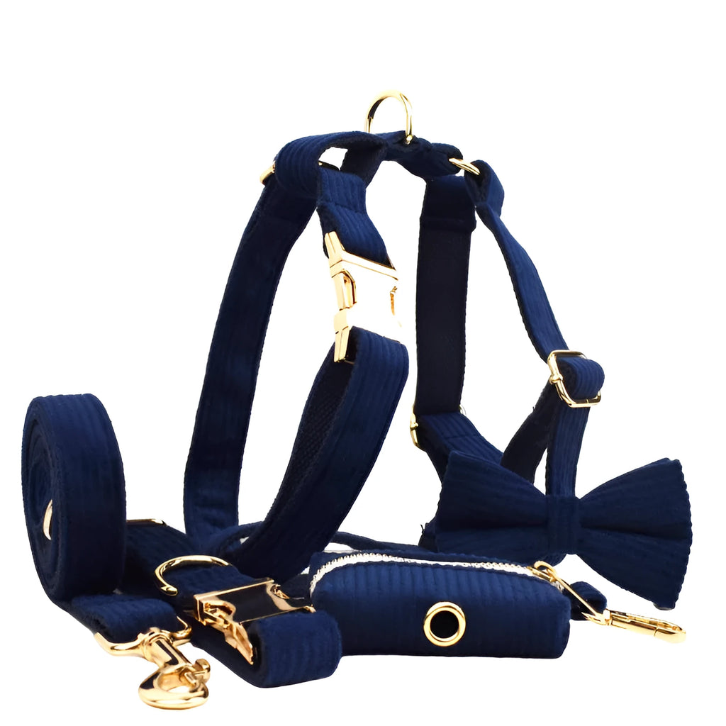 Navy blue corduroy dog collar set with matching leash, vest, bow, and poop bag