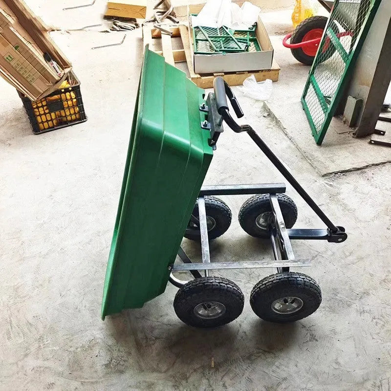 Green four-wheel steel and plastic dump truck with large load bed.