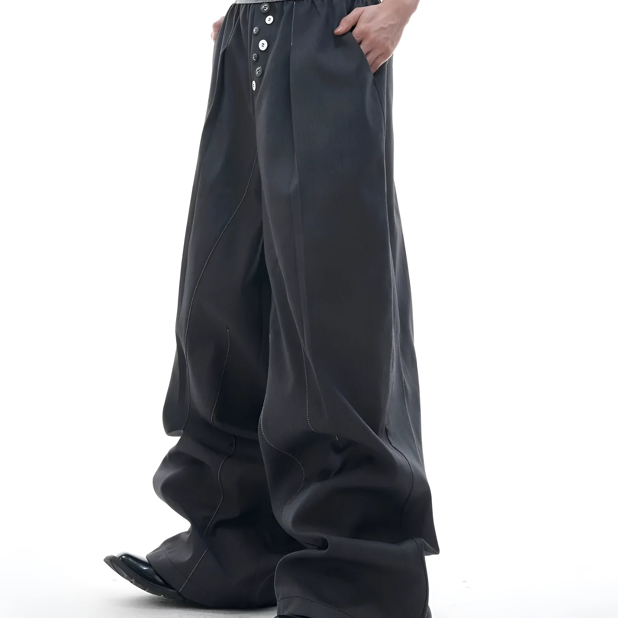 Drooping straight-leg casual pants in black with high waist and button open line design.