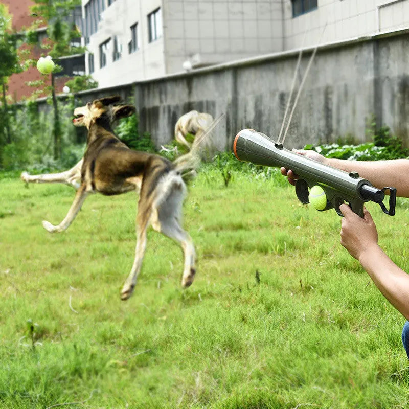Black tennis ball launcher for dogs with two tennis balls, measuring 65.5cm long