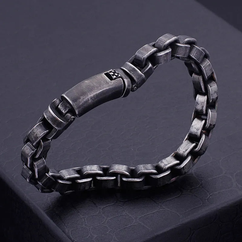 Black titanium steel punk chain bracelet with geometric design, 22cm length, on male wrist