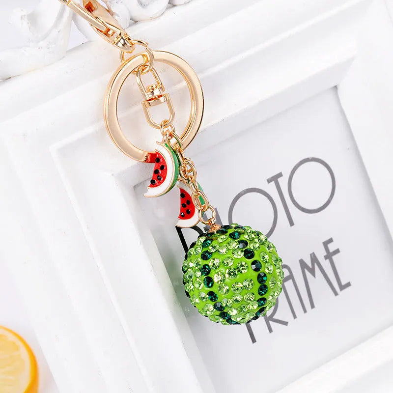 Green zinc alloy watermelon-shaped keychain charm on a metal ring.