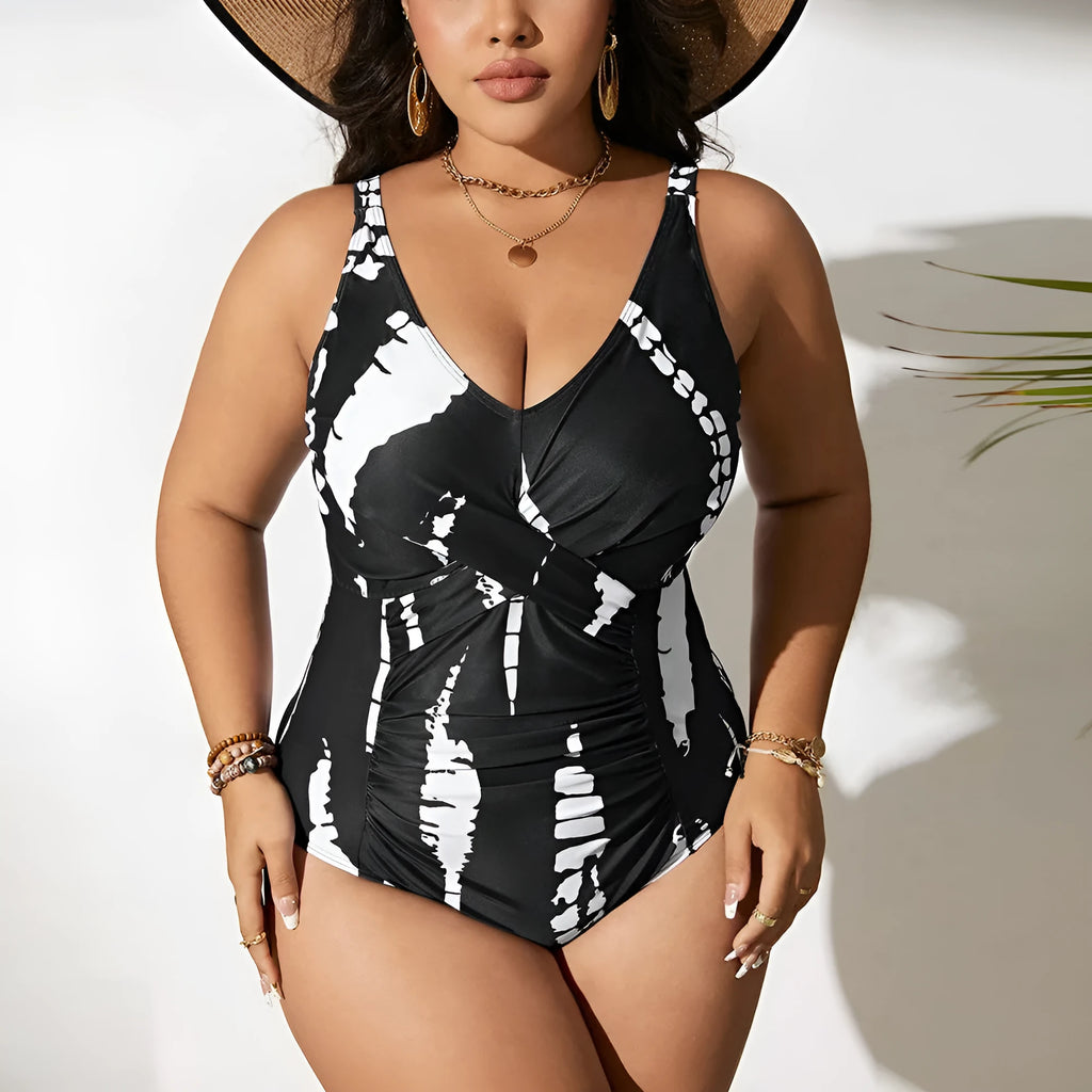 Black Siamese colour matching fit one-piece swimsuit for women on a size chart.
