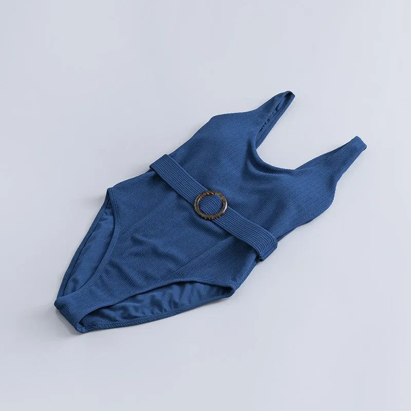 Navy blue women's one-piece swimsuit with triangle neckline, slim fit, and sleeveless design.