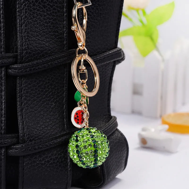 Green zinc alloy watermelon-shaped keychain charm on a metal ring.