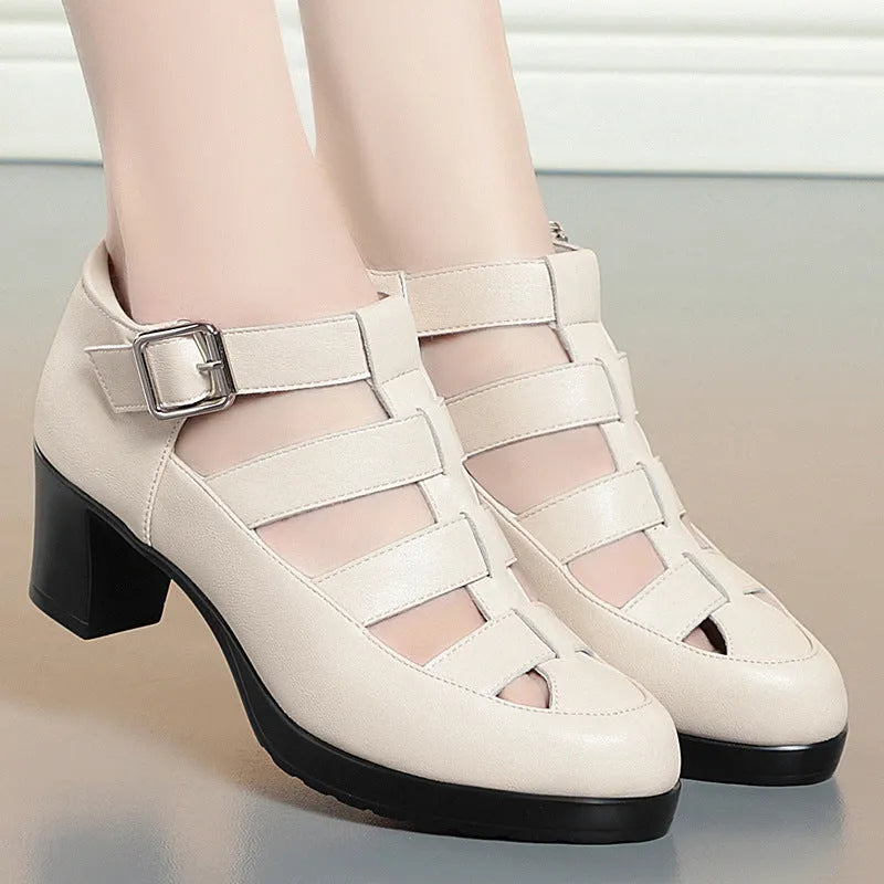 Women's closed toe sandal with chunky heel, woven upper, ankle strap, and back zipper.