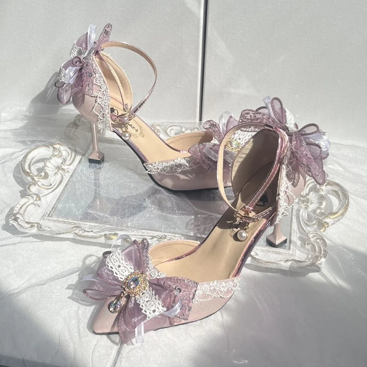Purple satin women's stiletto shoes with a square toe bracket, shown on a white background.