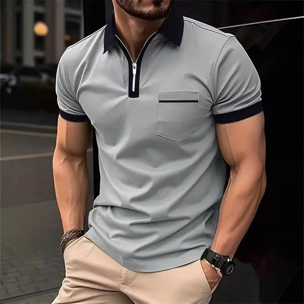 Man wearing a loose fit casual short sleeve shirt with a chest pocket and zipper decoration.