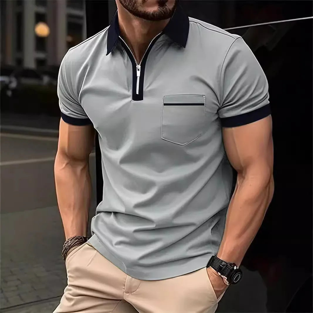 Man wearing a loose fit casual short sleeve shirt with a chest pocket and zipper decoration.