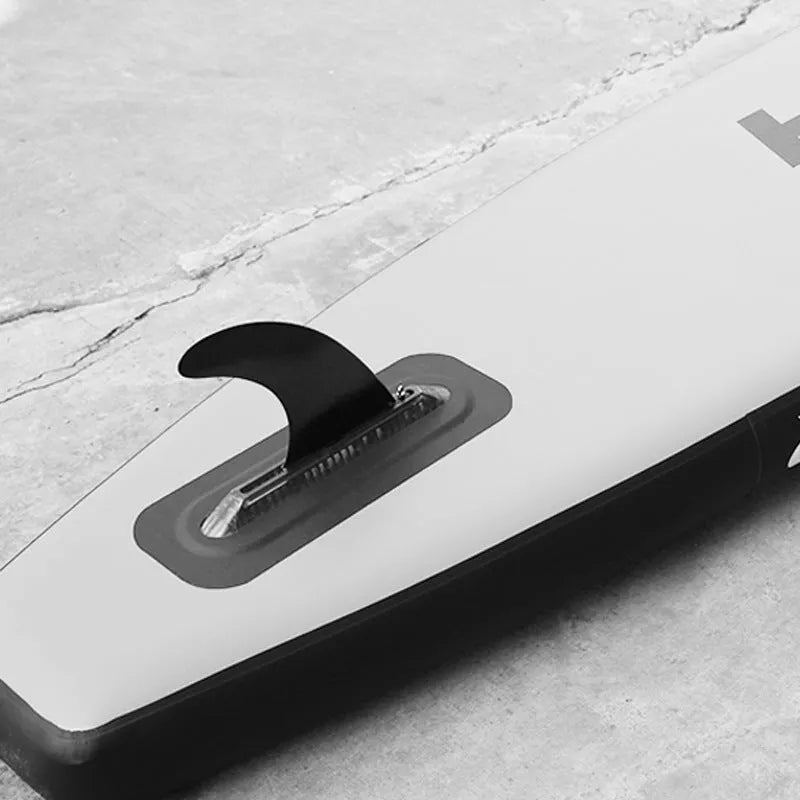 SUP paddle with large removable plastic fish fins on a white background