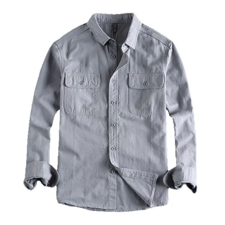 Man wearing a loose-fit light grey long sleeve cardigan-style shirt made from polyester.
