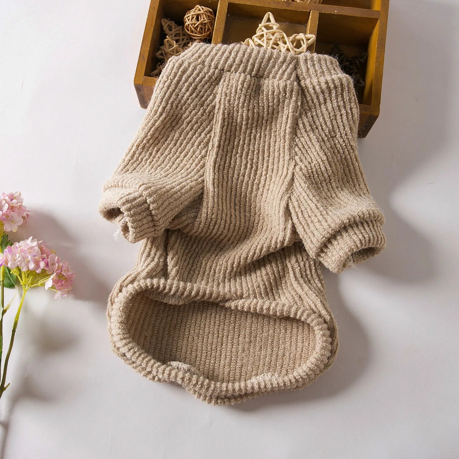 Brown knitted cloth sweater pullover on a small dog, showing casual style.