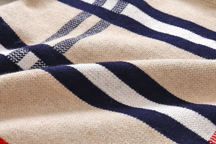 Boy wearing a navy blue plaid jacquard knit pullover sweater