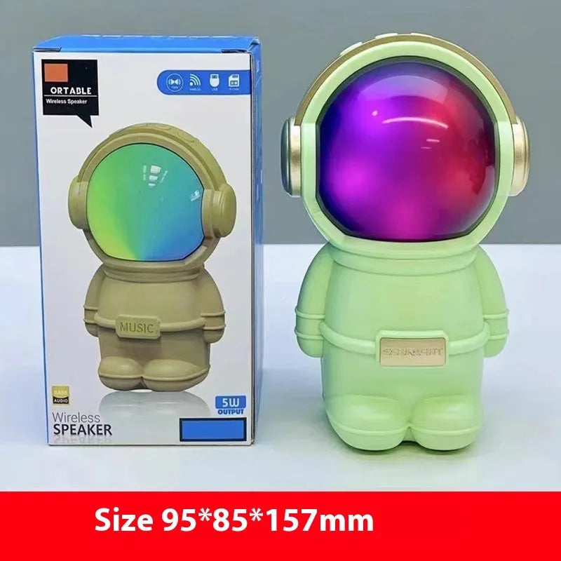 Spaceman mini stereo speaker in pink, USB powered with lighting, on a desktop