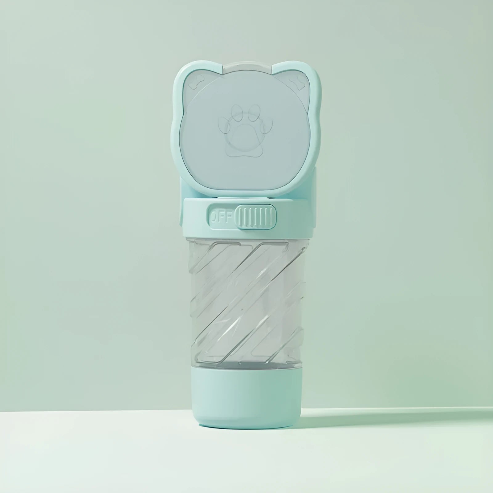 Green 3-in-1 portable pet water bottle with food container, waste bag dispenser, and carrying strap.