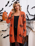 Women's black knitted cardigan with an orange jacquard pumpkin head pattern on the front.