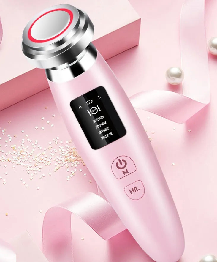 Pink portable skin rejuvenation and facial cleansing beauty instrument showing its compact size.