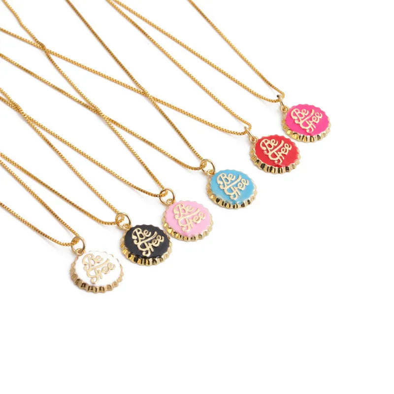 Copper bottle cap pendant necklace with 18K gold plating on a 40 cm box chain.