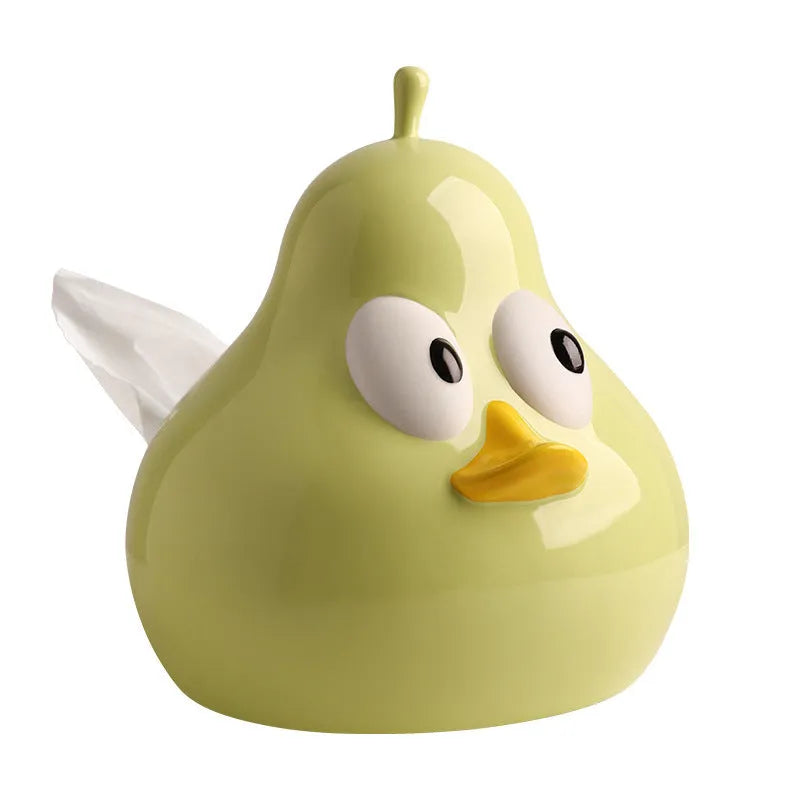 Green ceramic pear-shaped tissue box holder on wooden desk