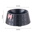 Ceramic pet bowl with diamond pattern and bowknot design in black, purple, and white options