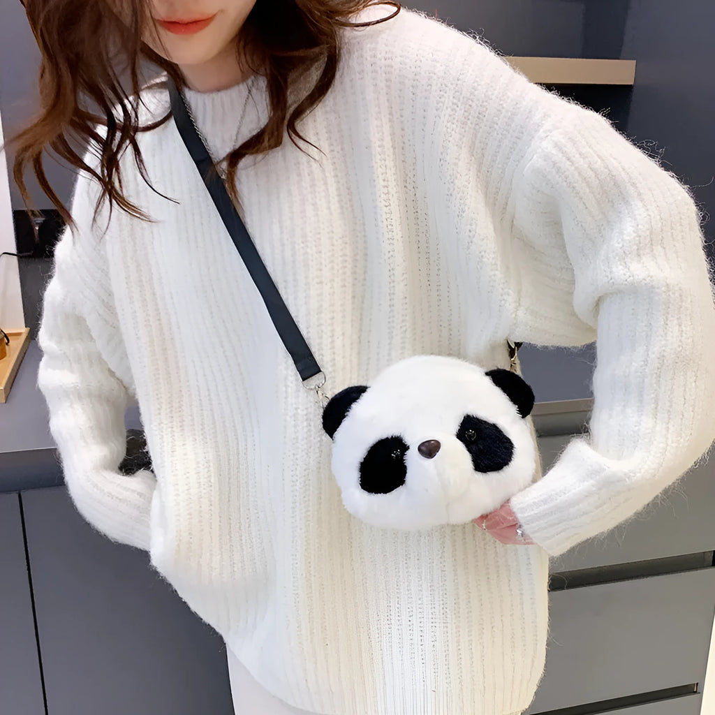 Soft plush panda head design crossbody bag in cylindrical shape on a white background.