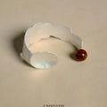 Alloy ring and bracelet set with diamond shape and small round spoon stewed pork motif.