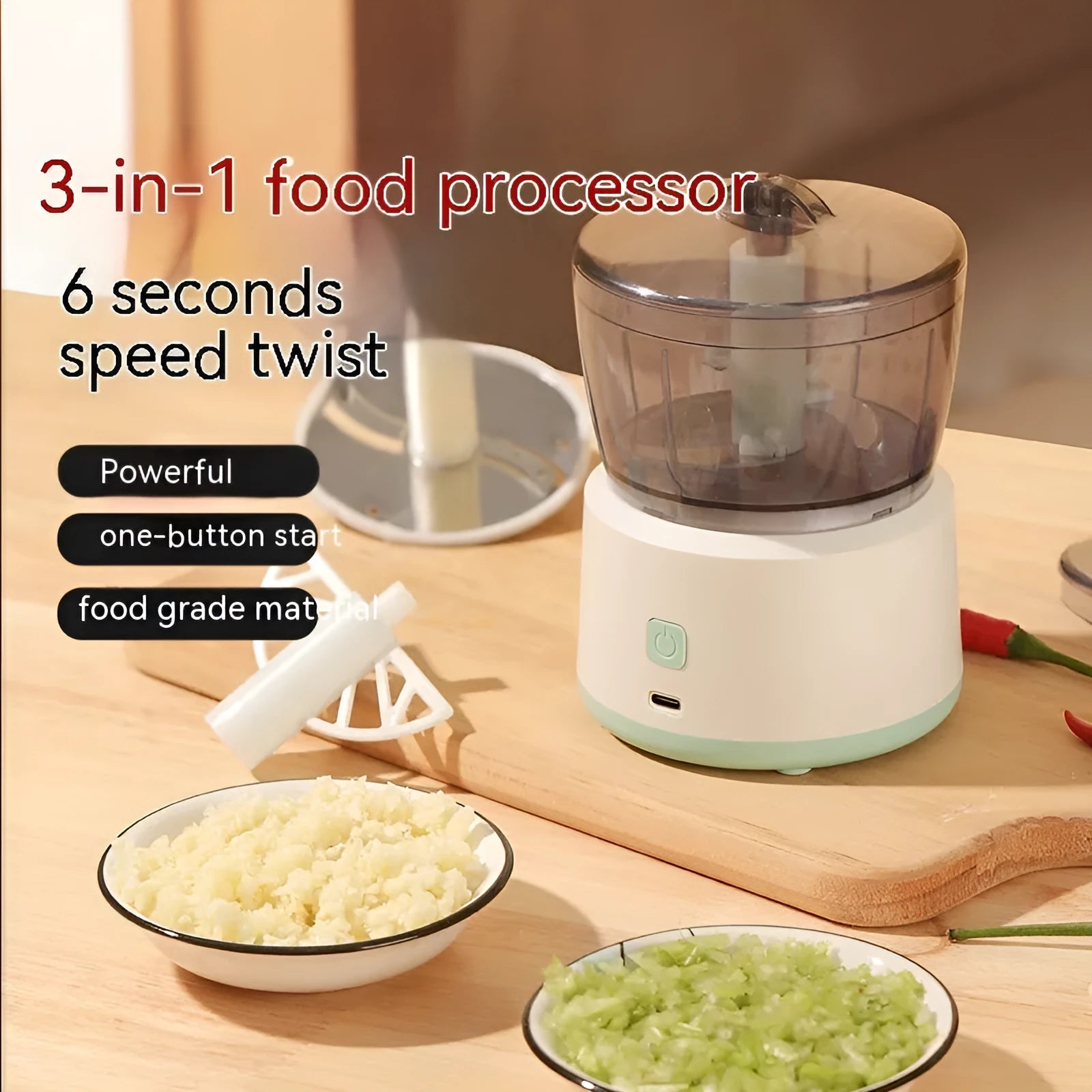 Mini electric meat grinder with transparent bowl in light green colour on a kitchen countertop.