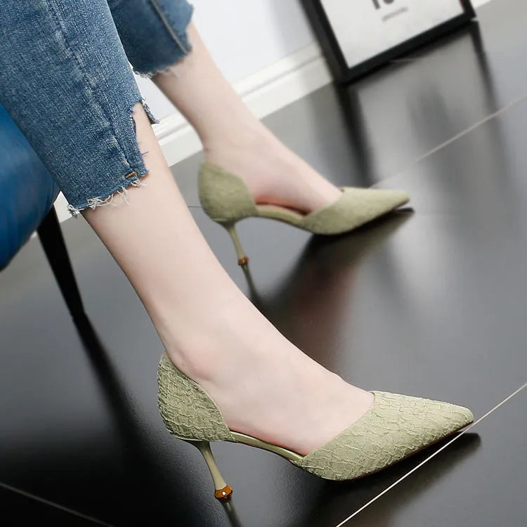 Women's black pointed-toe stiletto high heels with leather stitching details and 6-8cm heel