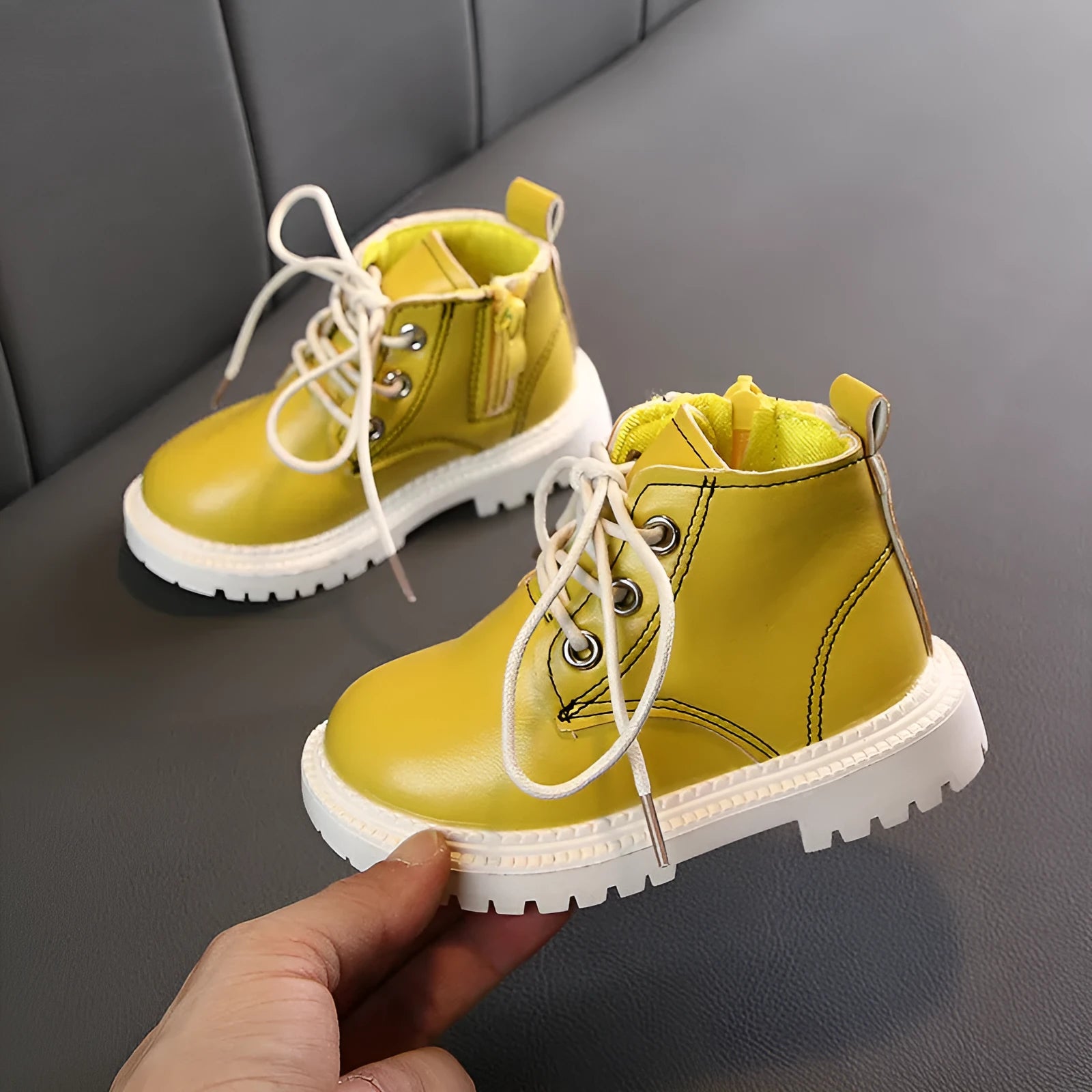 Boys leather short boots with synthetic upper and rubber sole in beige colour, side view