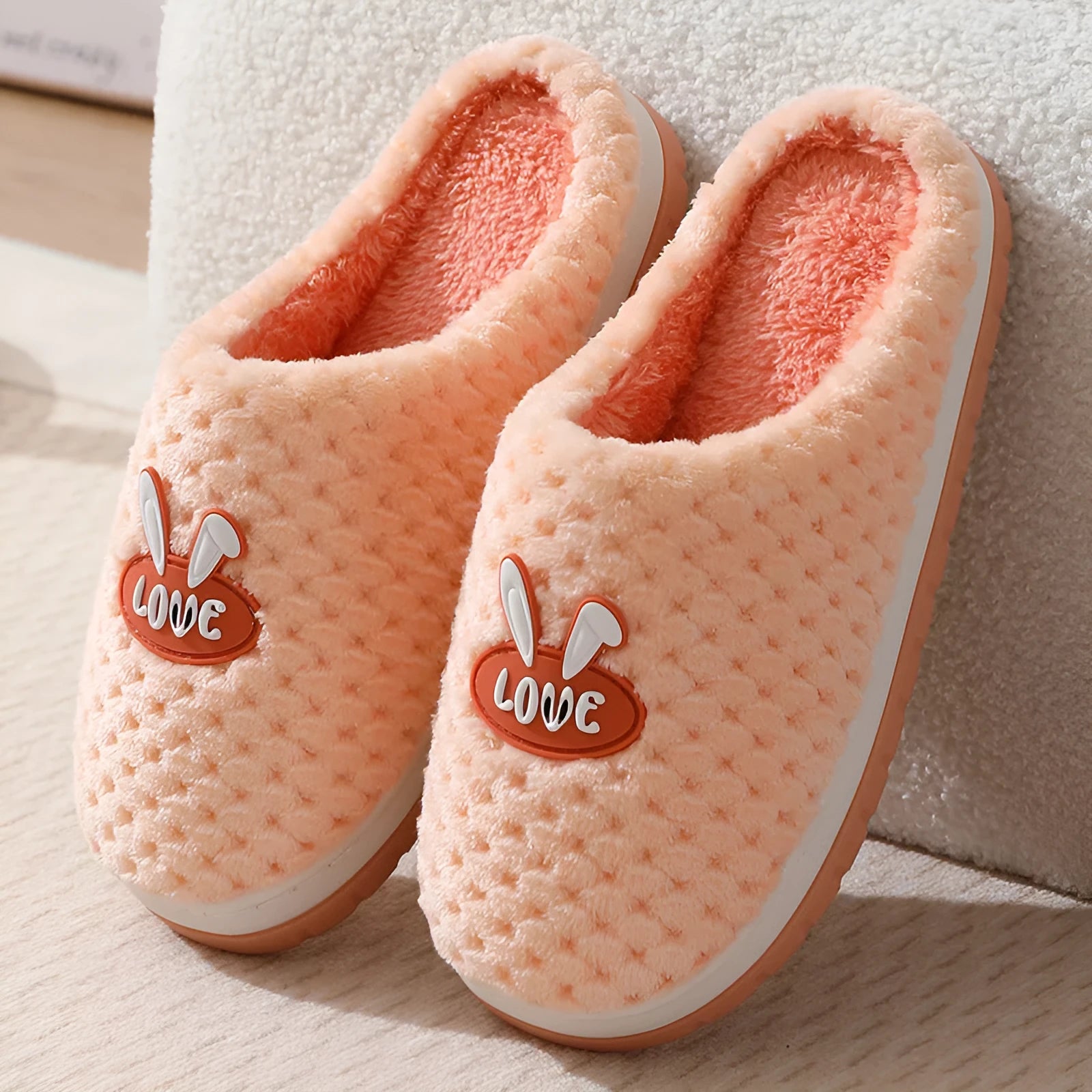 Women's rabbit plaid patterned artificial fur slippers with a thick sole and non-slip rubber base.
