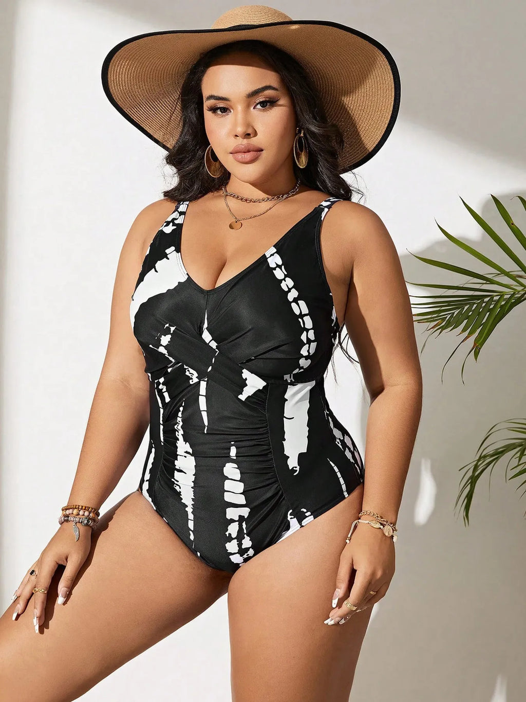Black Siamese colour matching fit one-piece swimsuit for women on a size chart.