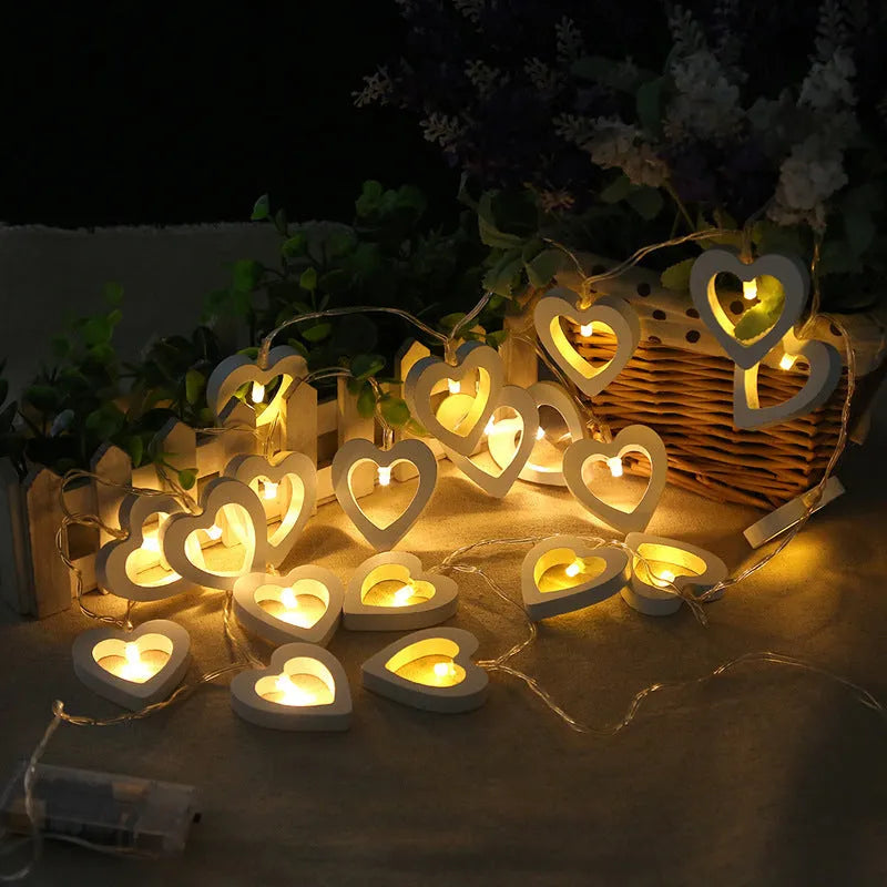 Wooden love lantern string with warm white LEDs on a USB battery cable