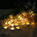 Wooden love lantern string with warm white LEDs on a USB battery cable