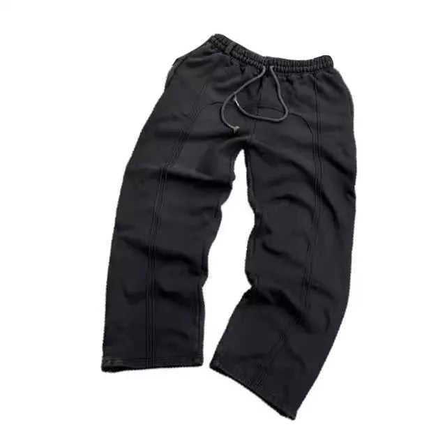 Men's loose cropped polyester sweatpants with quilted tooling style in black, grey, or green