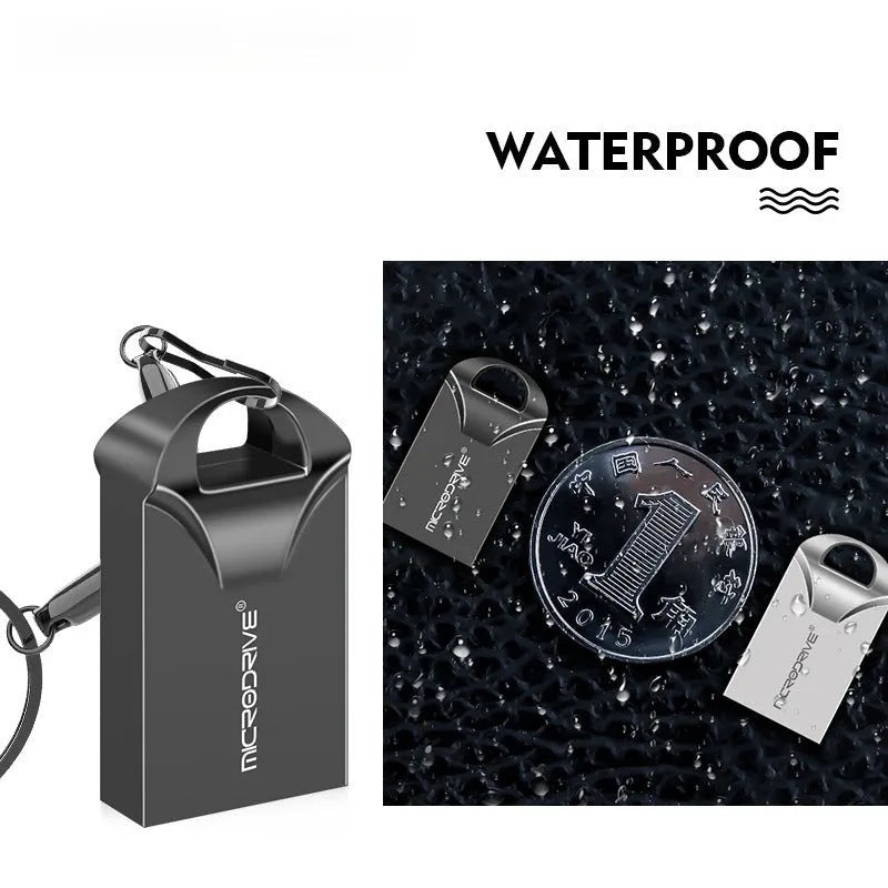 Small silver and black metal USB flash drive on a white background